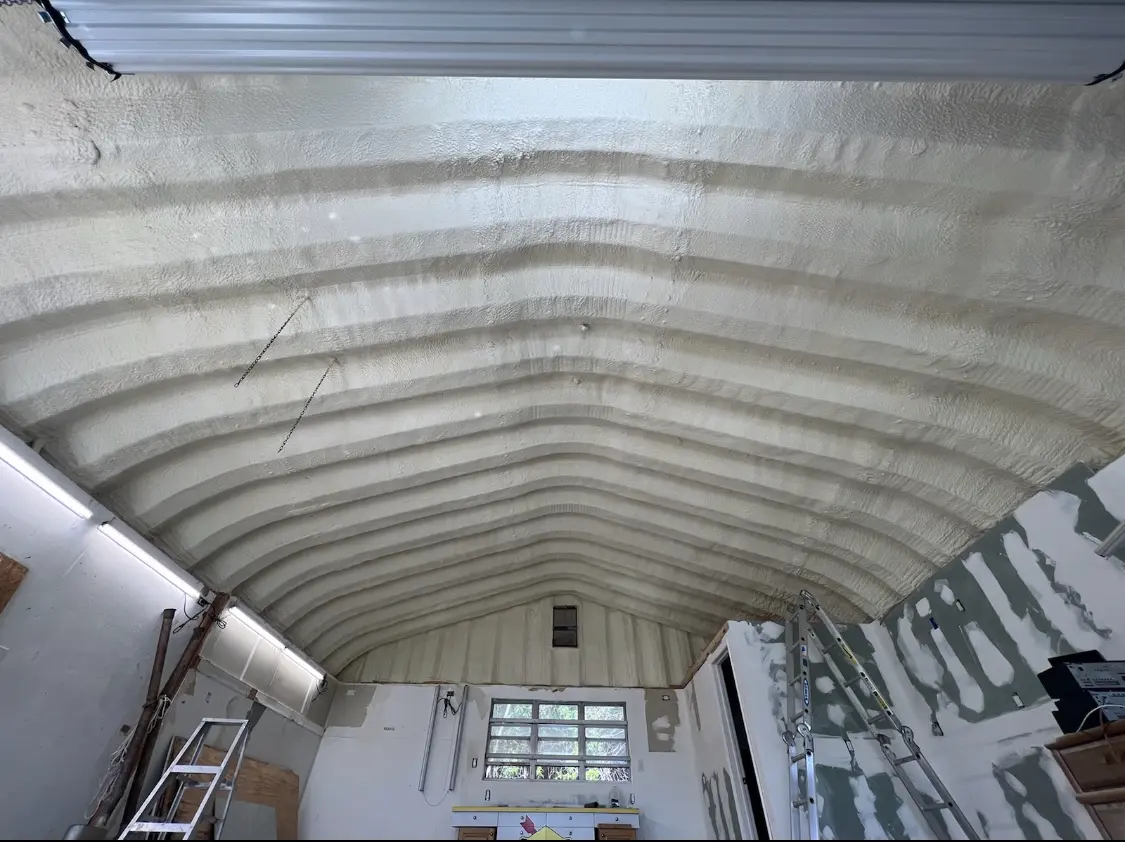 Spray polyurethane foam applied to the underside of a metal roof deck in Murraysville